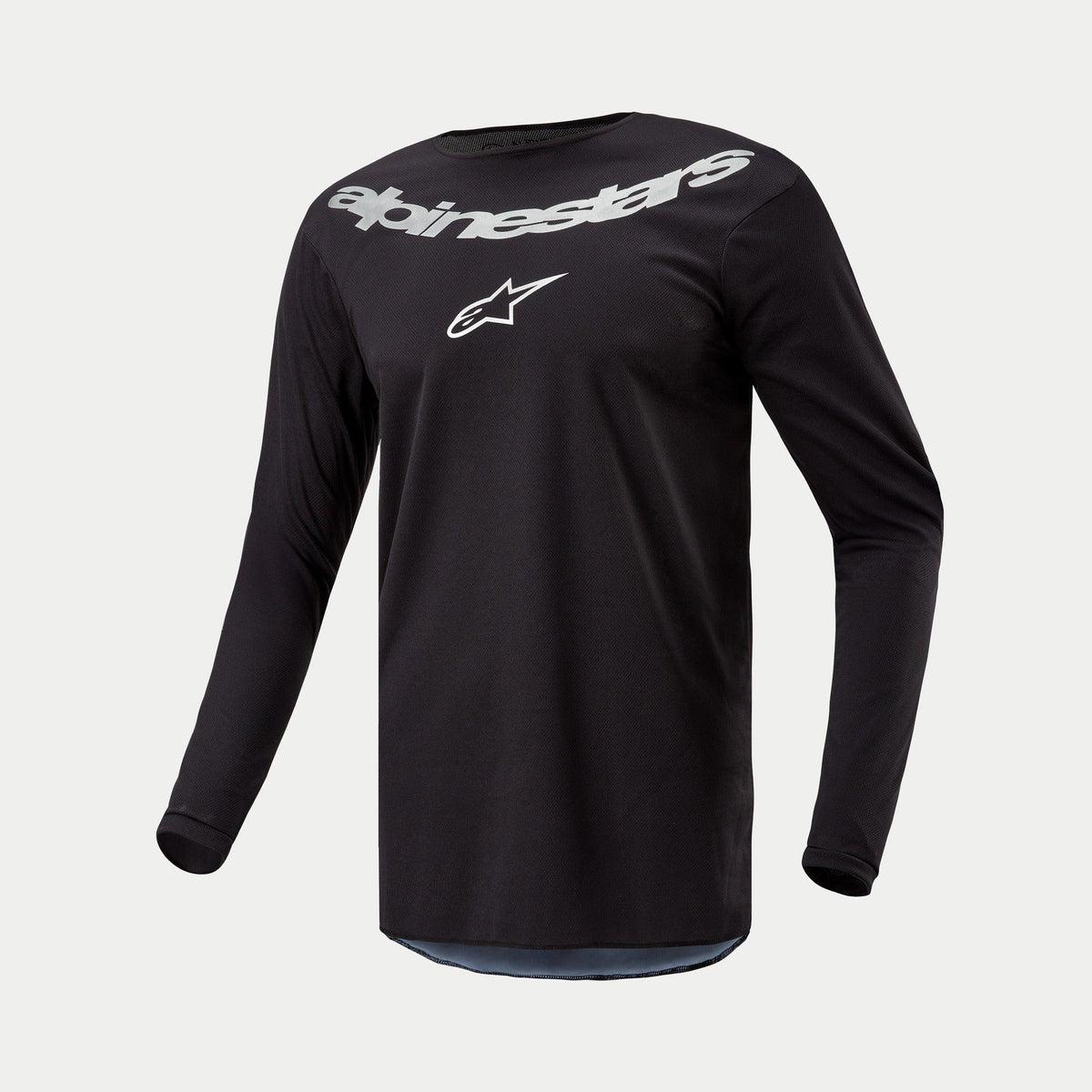 Alpinestars 2024 Fluid Graphite Jersey, Motocross Jersey, Black Silver, long-sleeve performance top featuring large silver Alpinestars branding and star logo on chest, lightweight moisture-wicking poly-fabric for off-road riding