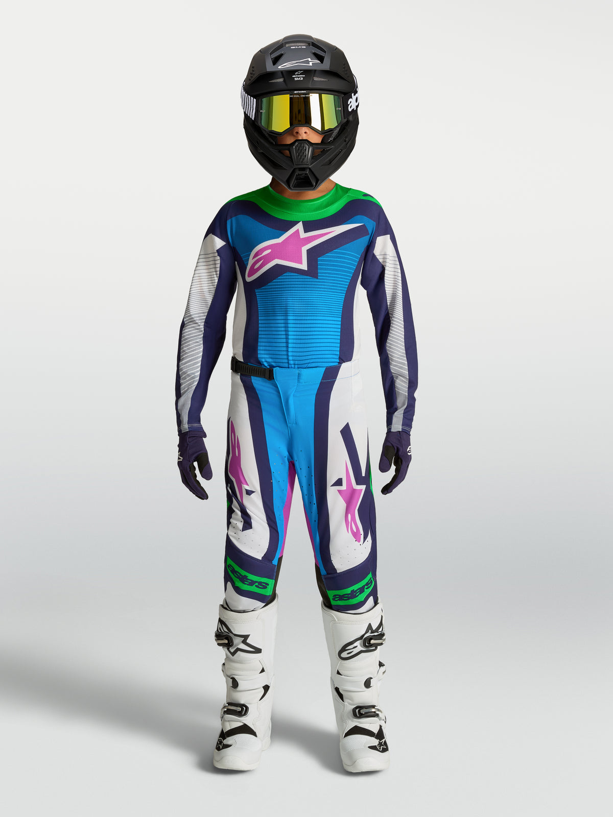 Alpinestars Youth Supertech Maven Gear Set, blue and white motocross outfit with green and pink accents, on-model.