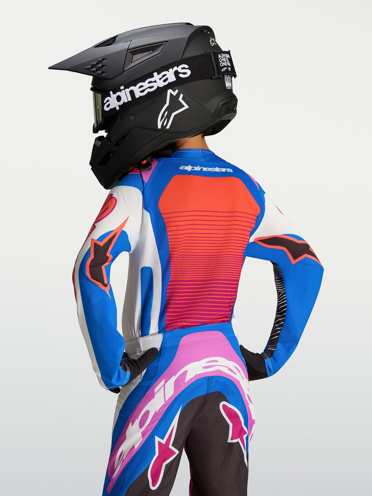 Alpinestars Youth Supertech Maven Jersey, blue and hot coral motocross gear with vented mesh and athletic racing fit.