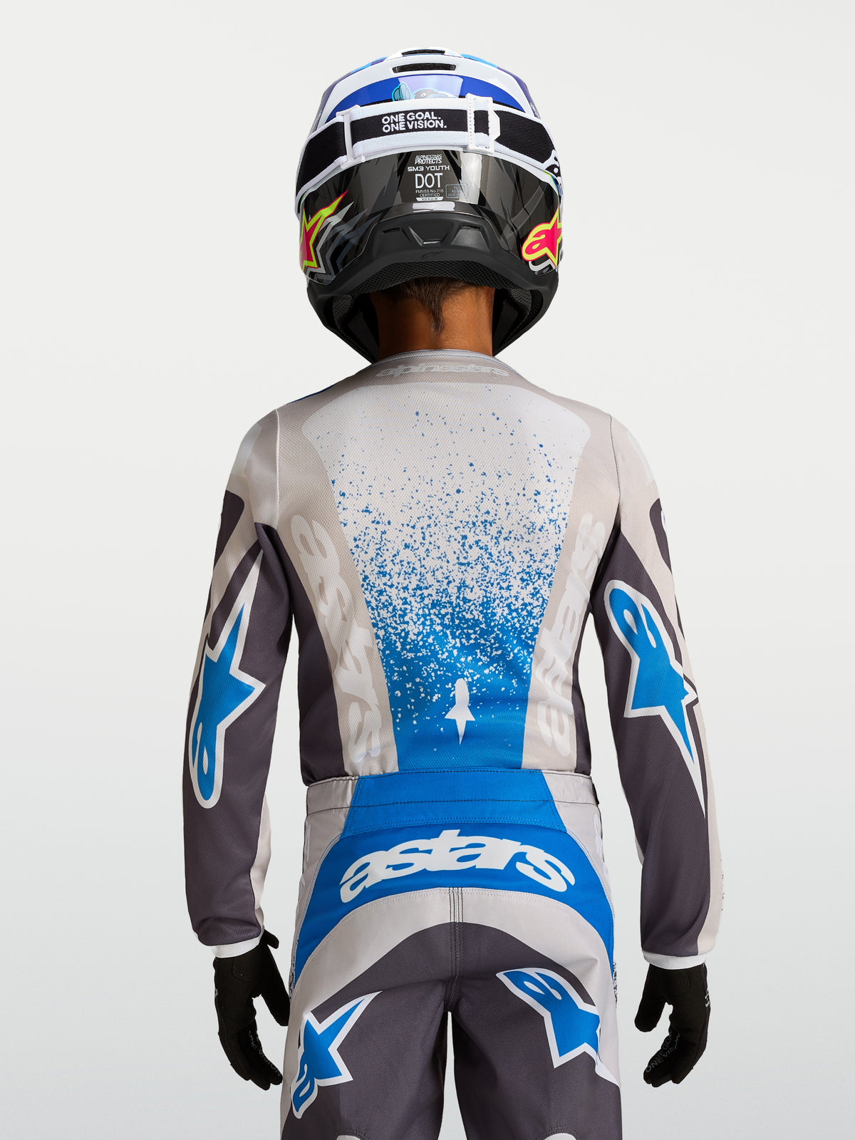 Alpinestars Youth Fluid Drag Jersey, gray and blue motocross racing gear with breathable polyfabric construction.