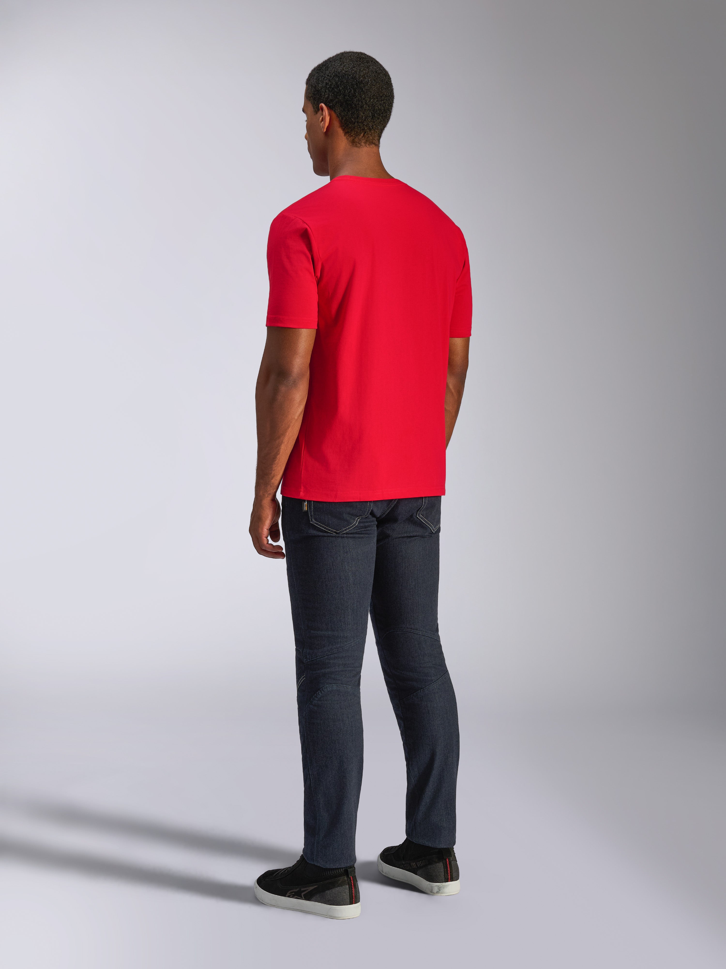 Alpinestars CSF Tee, Short Sleeve T-Shirt, Red, back view on model, worn with dark jeans and black shoes, casual motorsport-inspired streetwear