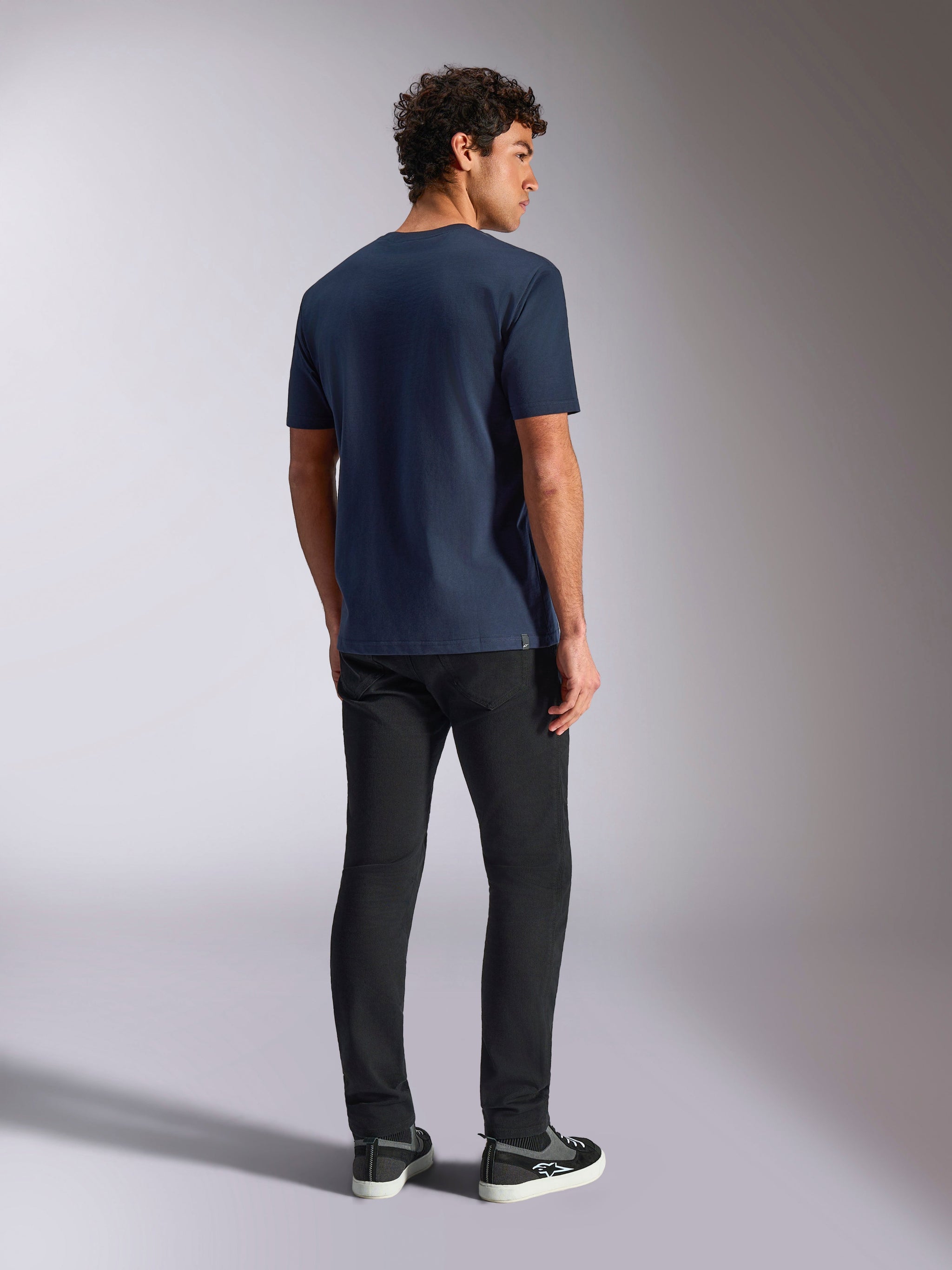 Alpinestars MX Helmet CSF Tee, Short Sleeve T-Shirt, Navy, back view on model, casual motorsport-inspired sportswear, worn with black pants and sneakers