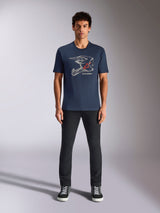 Alpinestars MX Helmet CSF Tee, Short Sleeve T-Shirt, Navy Blue, featuring White Motocross Helmet Graphic with Red Star Logo, worn by model with black pants and sneakers, casual motorsport-inspired streetwear