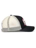Alpinestars Heritage Patch Trucker Hat, Black and White sportswear cap with mesh back, curved bill, and embroidered patch.