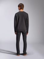 Alpinestars Positive Crew, Black Pullover Sweatshirt, back view on male model, worn with black jeans and casual sneakers, featuring ribbed cuffs and hem, motorsport-inspired streetwear