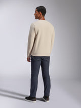 Alpinestars Positive Crew, Off White crewneck sweatshirt, back view on model, paired with dark denim jeans and black sneakers, casual motorsport streetwear, featuring ribbed cuffs and hem