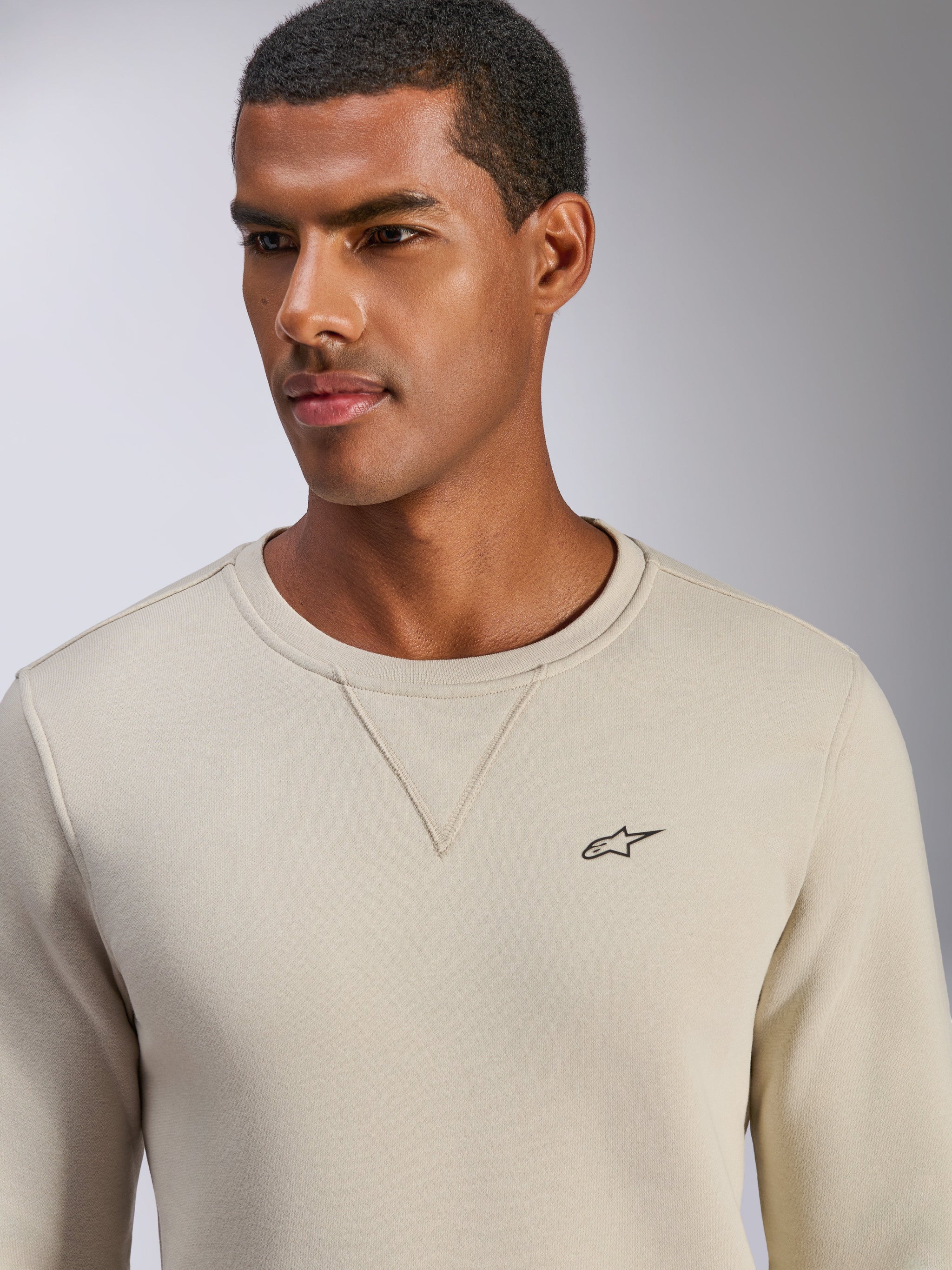 Alpinestars Positive Crew Sweatshirt, Off White, crewneck pullover with small black star logo on chest, V-stitch neckline detail, casual motorsport-inspired lifestyle apparel