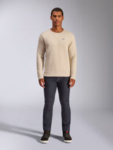 Alpinestars Positive Crew, Off White crewneck sweatshirt, small black logo on the chest, ribbed cuffs and hem, triangle neck stitching, casual motorsport streetwear worn with dark jeans