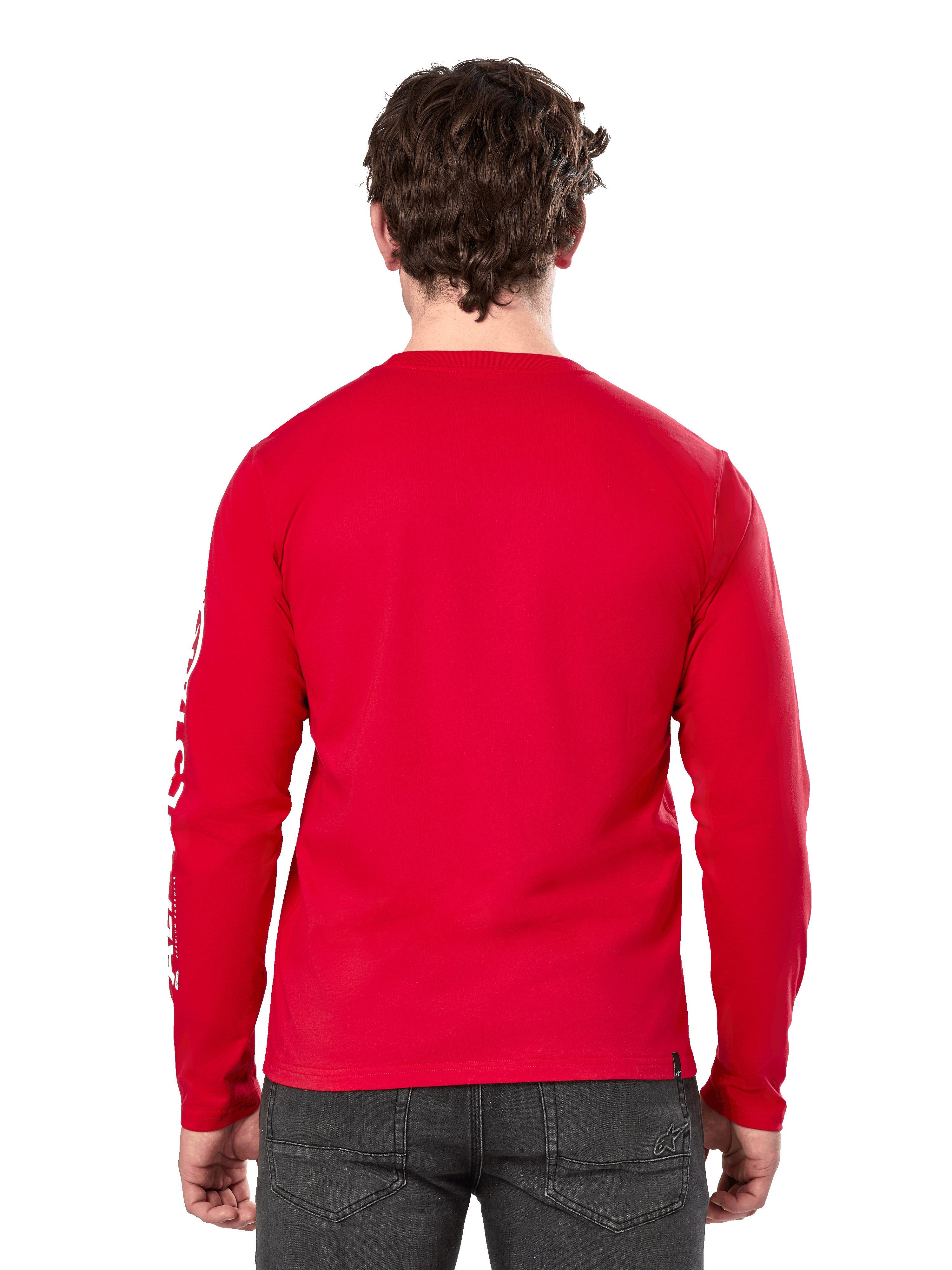 Rear view of a man wearing the Alpinestars Committed CSF Long Sleeve Tee in Red, paired with dark grey jeans, featuring a visible Alpinestars sleeve logo in white and a minimalist back design.
