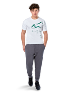 Alpinestars Geografica CSF Tee, Short Sleeve T-Shirt, White, Green Astars Logo with geographic multi-tech graphic, worn with grey sweatpants and black sneakers, casual motorsport streetwear
