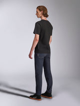 Alpinestars Luxo CSF Tee, Short Sleeve T-Shirt, Black, back view on model paired with dark blue jeans and black sneakers, casual motorsport-inspired streetwear