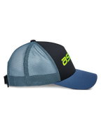 Alpinestars Vital Trucker Hat, side view, black front panel with blue curved bill and light blue mesh back, lime green logo detail, structured crown, casual motorsport-inspired headwear