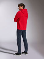 Alpinestars Emergent Oversized Hoodie, Red, rear view showing embroidered Alpinestars word logo on the back, oversized fit, worn with dark blue jeans and black sneakers, casual lifestyle streetwear