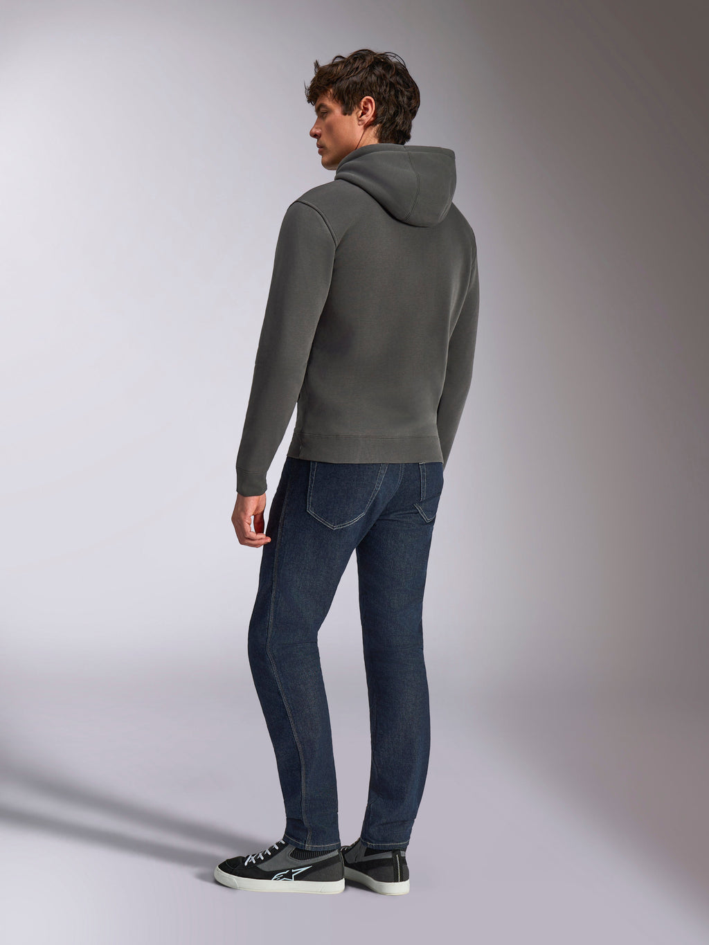 Alpinestars Ellipsoid Hoodie, casual sportswear, gunmetal gray, back view on male model, drawstring hood, long sleeves, ribbed cuffs and hem, paired with dark jeans and sneakers