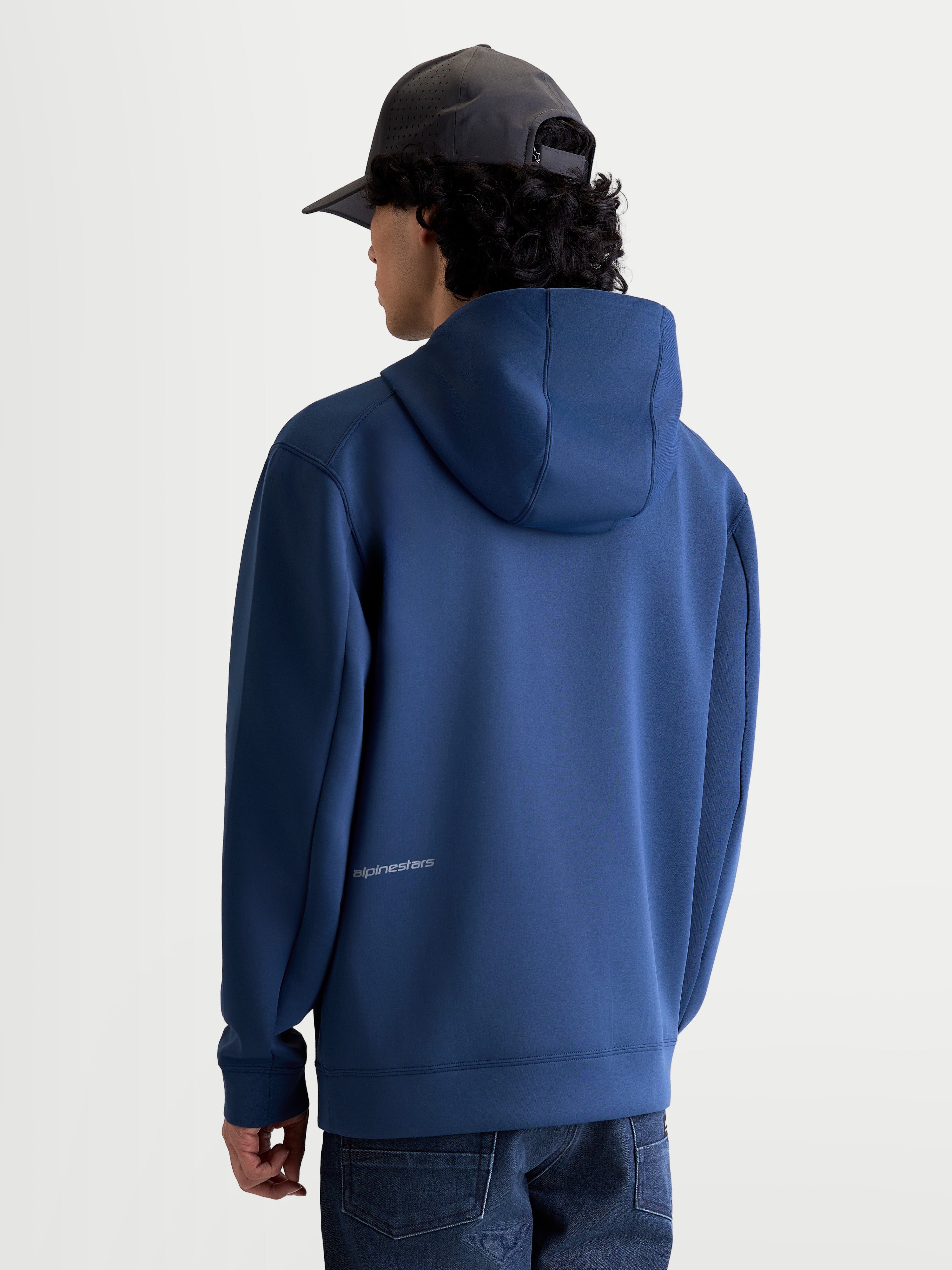 Alpinestars Cypher Hoodie, Steel Blue Sportswear Zip-Front Fleece, back view on model showing the high-neck mesh-lined hood and discreet Alpinestars logo on the lower back, premium tri-blend fabric for casual motorsport style.