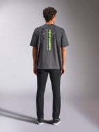 Alpinestars Overhang Oversized CSF Tee, Short Sleeve T-Shirt, Charcoal Gray, rear view featuring vertical neon green Alpinestars logo and graphic text, oversized fit, casual motorsport streetwear