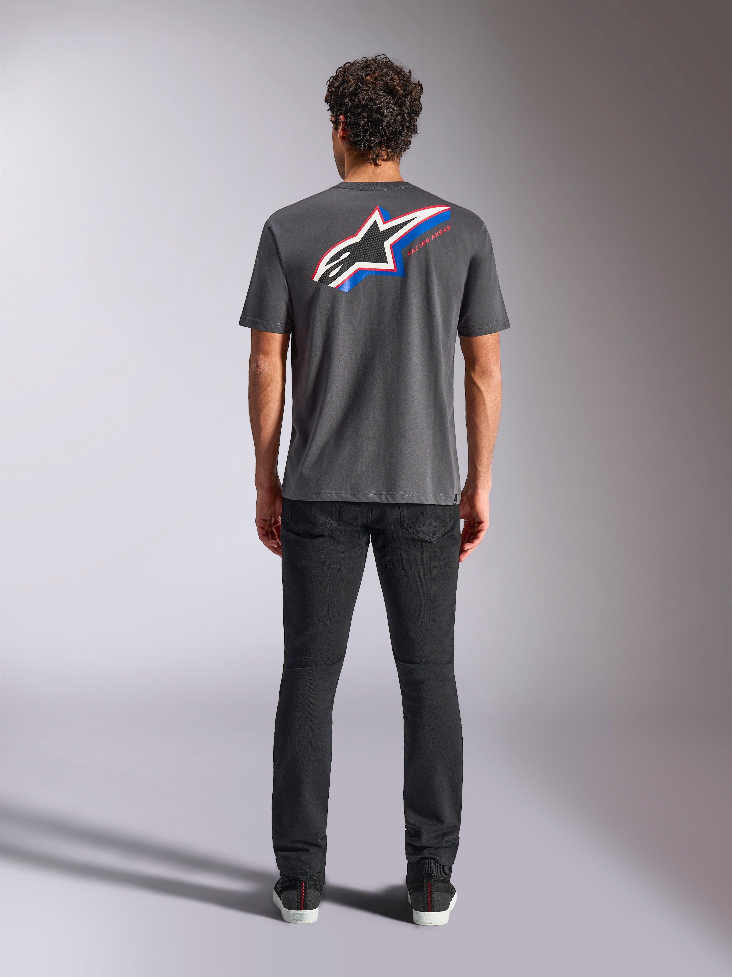 Alpinestars Angler CSF Tee, Short Sleeve T-Shirt, Charcoal, Large Multi-color Astars Logo on back with red and blue accents, rear view on model, casual motorsport streetwear