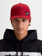 Alpinestars Pivot Hat, Dark Red Sportswear Baseball Cap, Unisex, front view on model featuring the embroidered Astars logo patch, curved bill, structured crown, and durable twill construction.