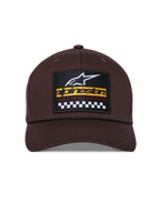 Alpinestars Matrix Snapback Hat, Brown, front view with structured crown and curved bill, multi-color embroidered patch with Alpinestars branding and checkered racing motif, black rope detail, casual motorsport-inspired headwear