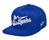 Alpinestars Los Angeles Hat, Blue Snapback Hat, White 3D embroidered Los Angeles athletic font logo, flat bill, structured crown, casual motorsport-inspired headwear