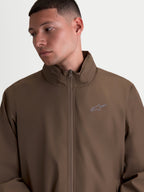 Alpinestars Overhaul Racer Jacket, Men's Lightweight Sportswear Jacket, Walnut Brown, featuring a motorsport-inspired design with a high collar, hidden hood compartment, and a small HD print logo on the chest.