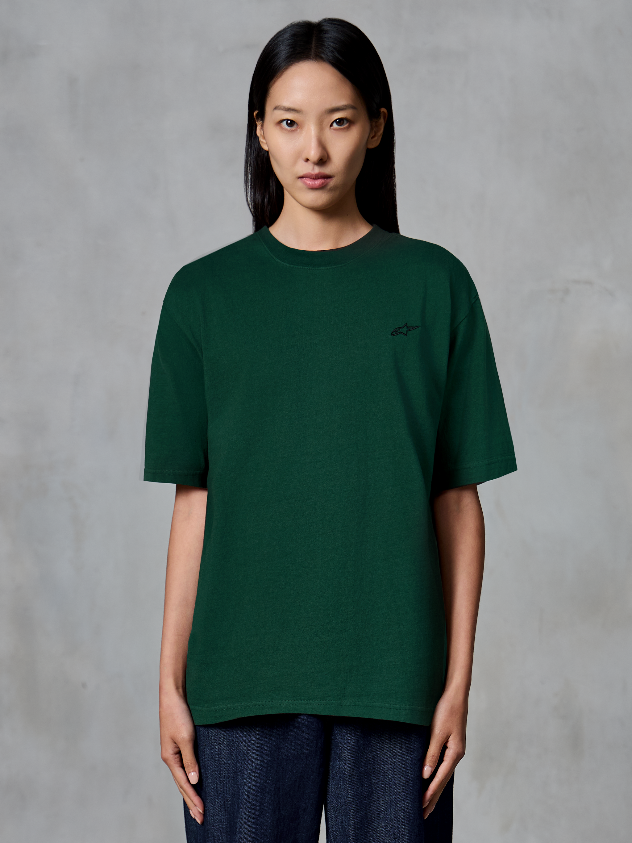 Alpinestars Essentials Ageless SS Tee, Short Sleeve T-Shirt, Pine Green, worn by model, featuring a small black chest logo, relaxed fit, organic cotton casual streetwear
