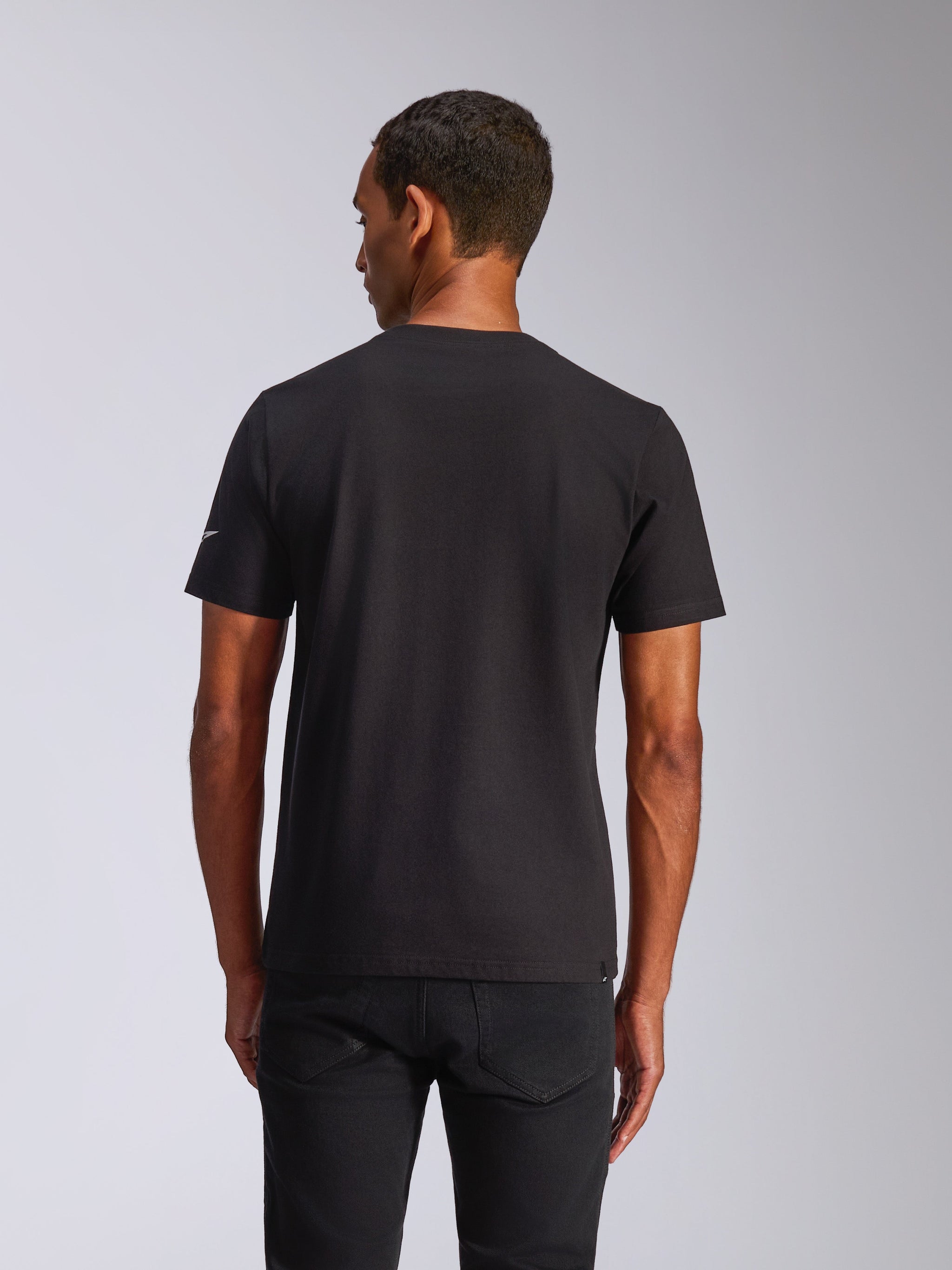 Alpinestars Waving CSF Tee, Short Sleeve T-Shirt, Black, back view on model wearing black pants, casual motorsport streetwear