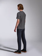 Alpinestars Waving CSF Tee, Short Sleeve T-Shirt, Charcoal, back-side view on model, small black star logo on sleeve, worn with dark denim jeans and black sneakers, casual motorsport streetwear