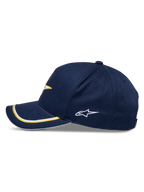 Alpinestars Ascension Snapback Hat, Navy Gold, side profile featuring a curved bill with gold and white double sutache trim, embroidered side logo, casual motorsport streetwear