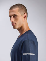 Alpinestars Frontal CSF Tee, Short Sleeve T-Shirt, Navy Blue, side profile view of male model, white Alpinestars logo on sleeve, performance moisture-wicking fabric, casual motorsport lifestyle