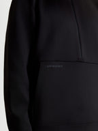 Alpinestars Apera Half-Zip Sweatshirt, Sportswear Pullover for Men and Women, Black, close-up showing the tonal HD logo print on the kangaroo pocket and half-zip design, premium tri-blend fleece construction.