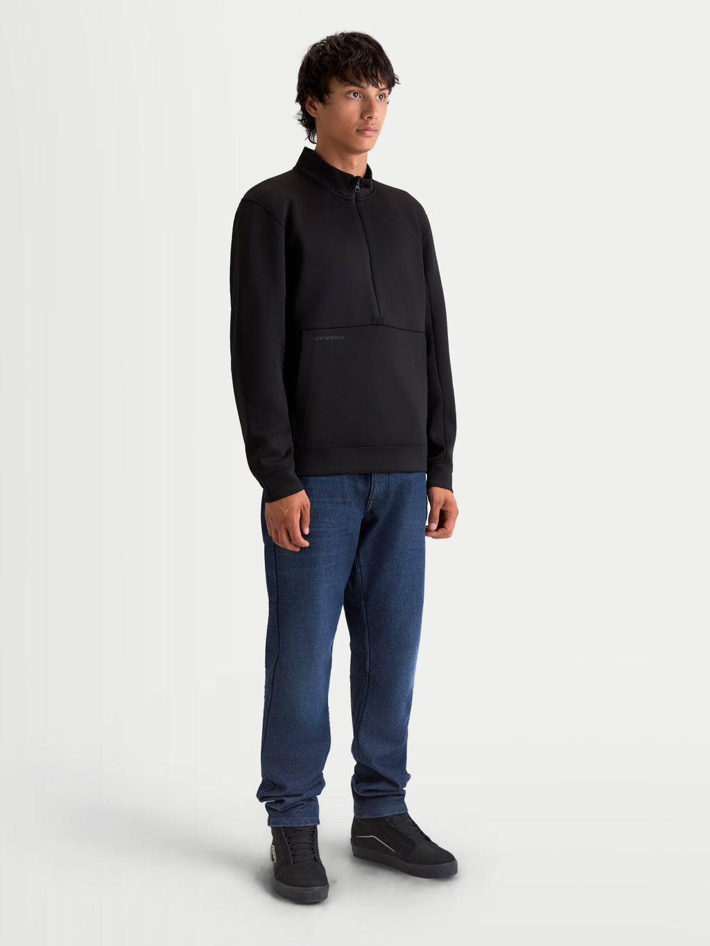 Alpinestars Apera Half-Zip Sweatshirt, Premium Motorsport-Inspired Sportswear Pullover, Unisex, Black, Tri-blend fleece construction with half-zip closure and kangaroo pocket, shown on model.