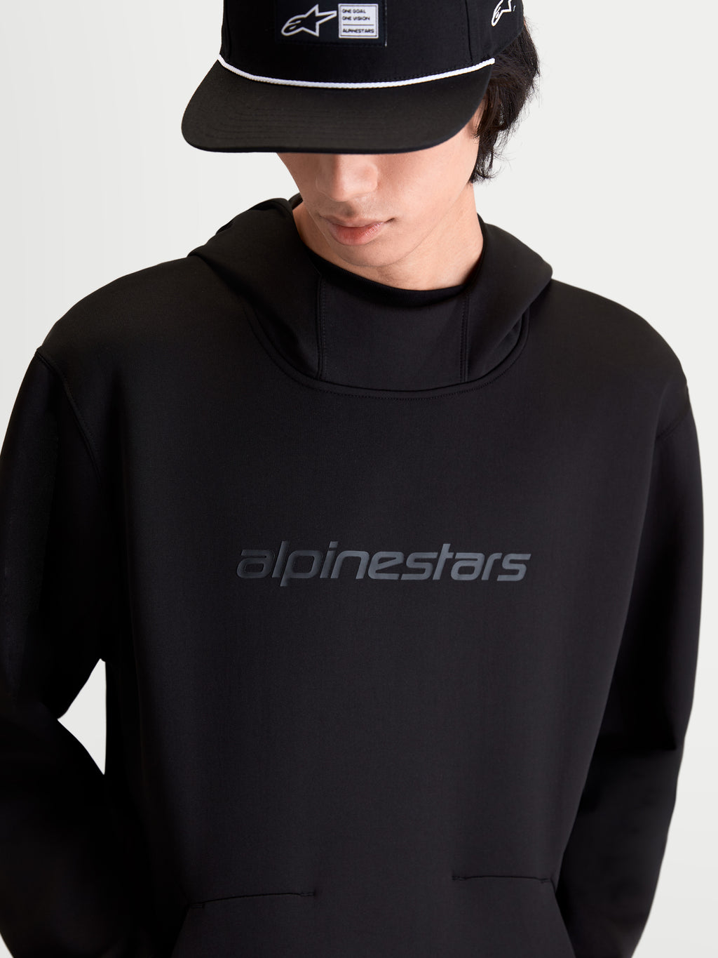 Alpinestars Datrix Hoodie, Casual Sportswear Pullover Hoodie, Black, featuring tri-blend double-face fleece, tonal HD Alpinestars chest logo, mesh-lined hood, and dart-detail pocket, on-model front view.