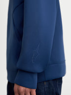 Alpinestars Datrix Hoodie, Premium Sportswear Pullover, Steel Blue, close-up view of the sleeve featuring a tonal HD Alpinestars logo, made from tri-blend double-face fleece fabric for casual everyday wear.