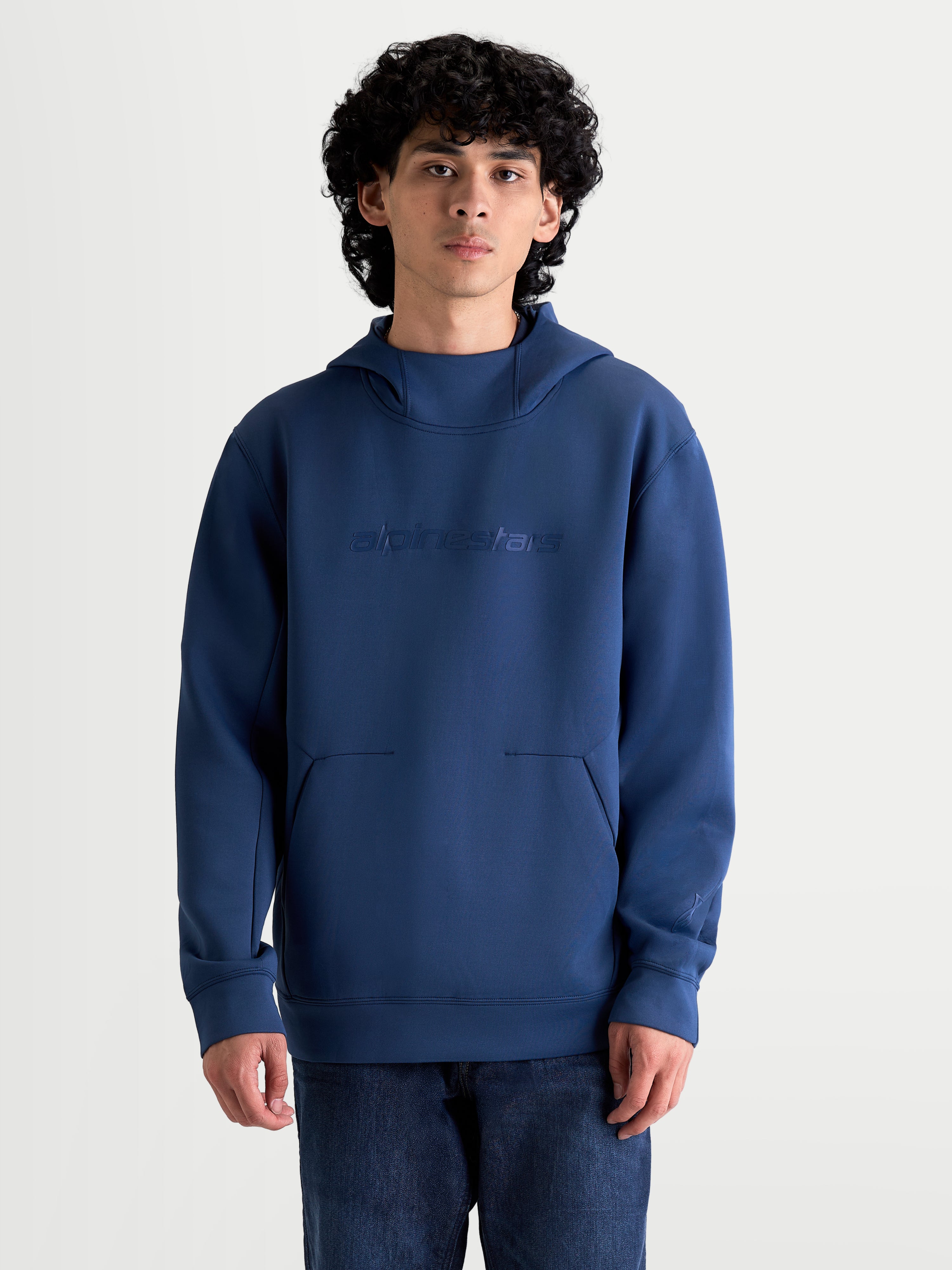 Alpinestars Datrix Hoodie, Men's Sportswear Pullover in Steel Blue, made from soft tri-blend fleece with a tonal Alpinestars logo, mesh-lined hood, and structured dart-detail pocket, on-model front view.