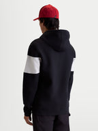 Alpinestars Cubic Hoodie, Sportswear Pullover Fleece, Black and White, featuring a color-blocked sleeve design, cotton and recycled polyester blend, shown in a back view on model for casual everyday style.