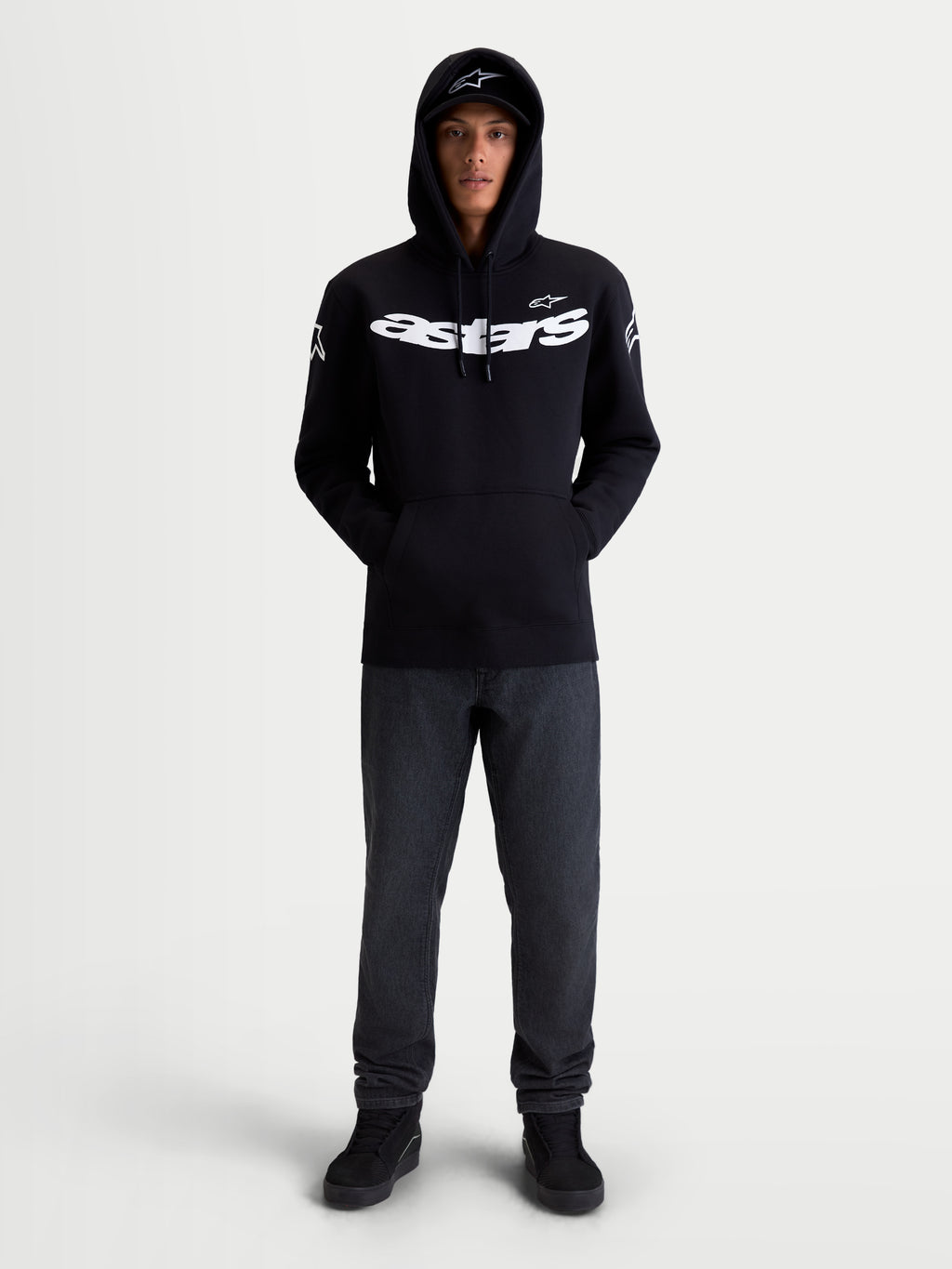 Alpinestars Velocifier Hoodie, Motorcycle Sportswear Pullover Fleece, Unisex, Black and White, Cotton and Recycled Polyester Blend, featuring bold Astars chest branding and shoulder logos, on-model front view for off-bike casual wear.