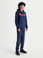 Alpinestars Velocifier Hoodie, Navy Blue and Orange, Men's Sportswear Pullover Fleece with bold astars chest wordmark and shoulder logos, shown on-model for casual off-bike motorsport-inspired wear.