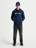 Alpinestars Race Wordmark Hoodie, Sportswear Pullover Fleece for Men and Women, Navy Blue and White, featuring a bold front wordmark graphic and Ageless sleeve logo, on-model lifestyle view for a casual motorsport-inspired look.
