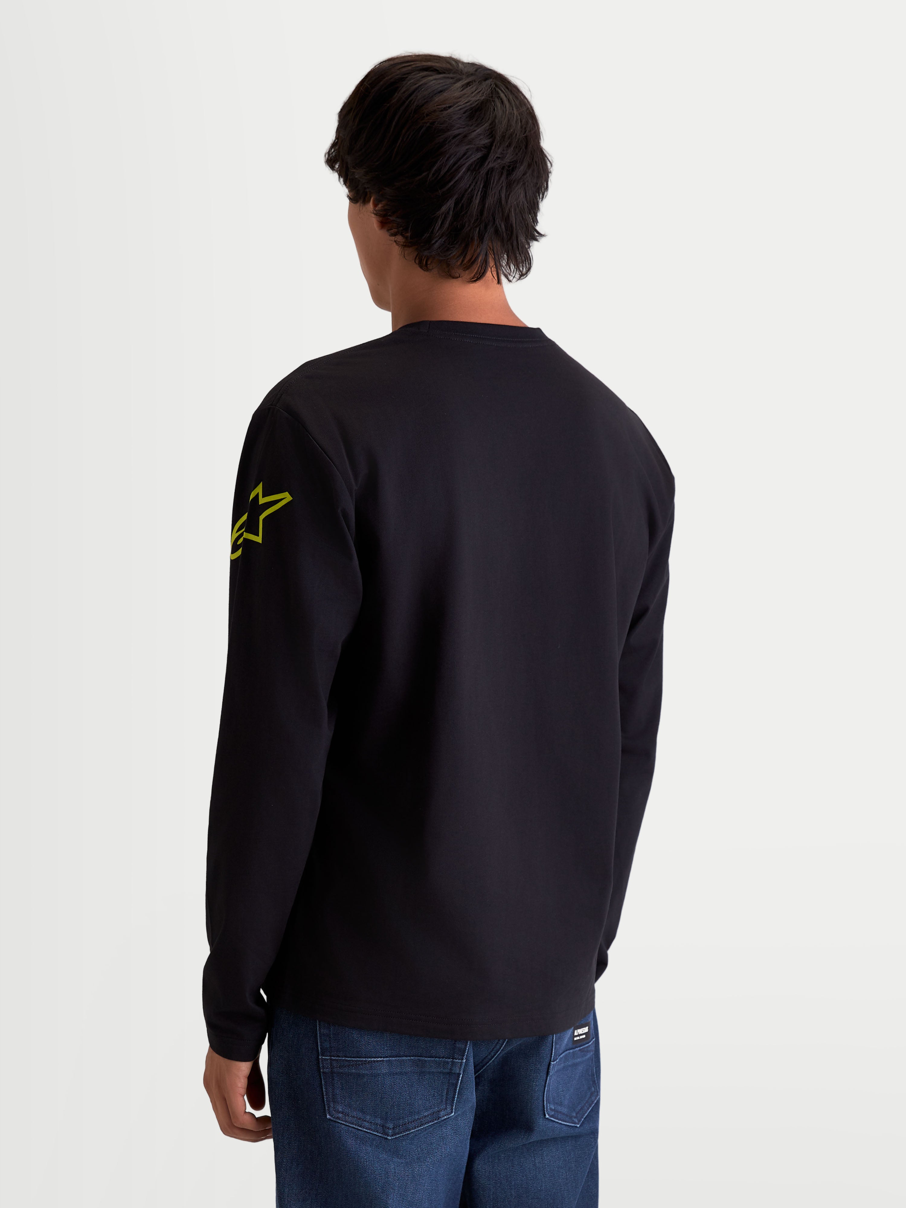 Alpinestars Velocifier CSF Tee, Long Sleeve Sportswear T-Shirt, Unisex Casual Wear, Black and Yellow, Cotton and Recycled Polyester Blend, Rear View on Model showcasing the Astars logo on the arm and rib cuffs.