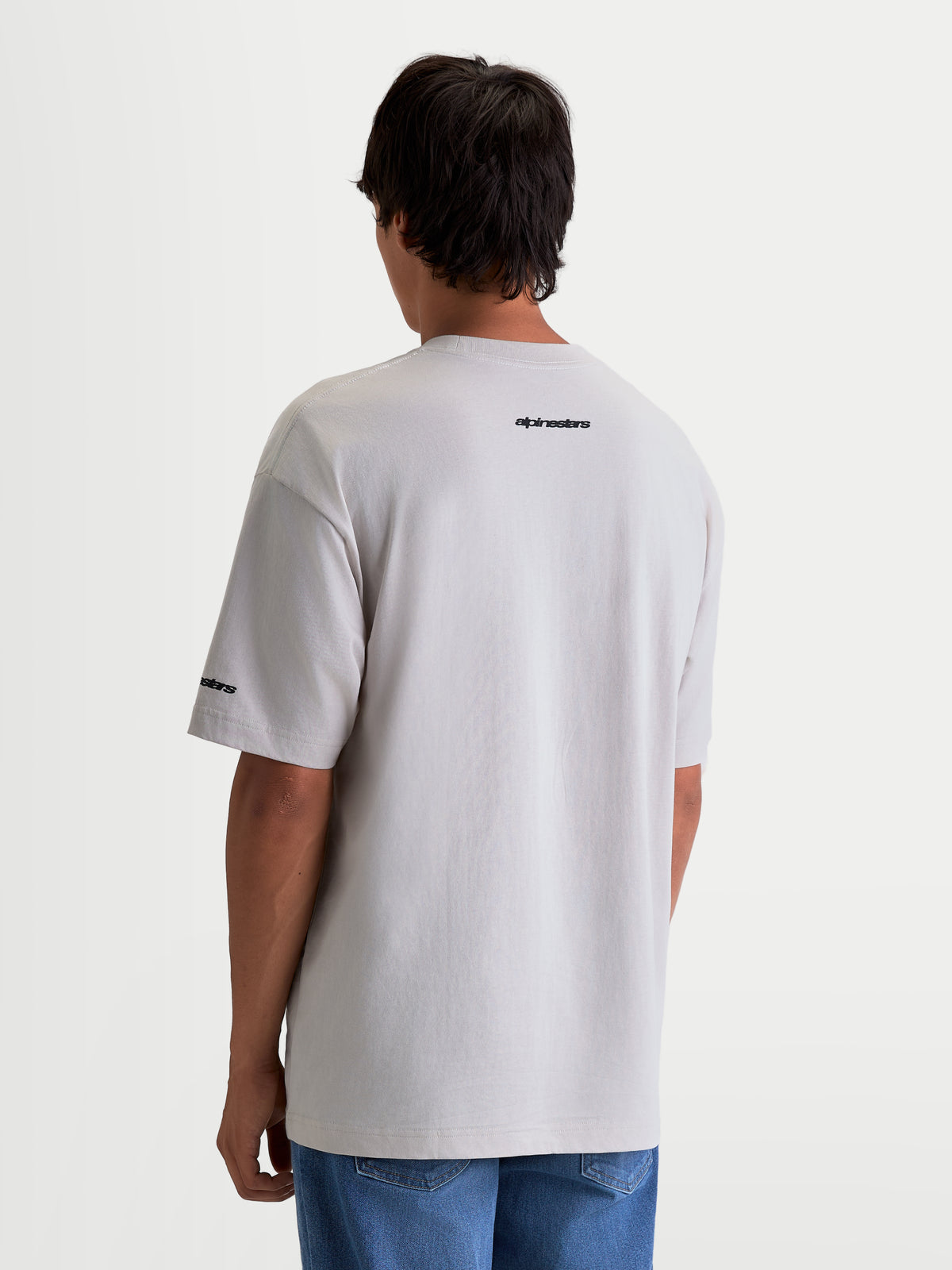 Alpinestars Mandate Oversized CSF Tee, Men's Short Sleeve Sportswear T-Shirt, Cement Gray, features Alpinestars wordmark graphics on the back shoulder and sleeve, relaxed oversized fit.
