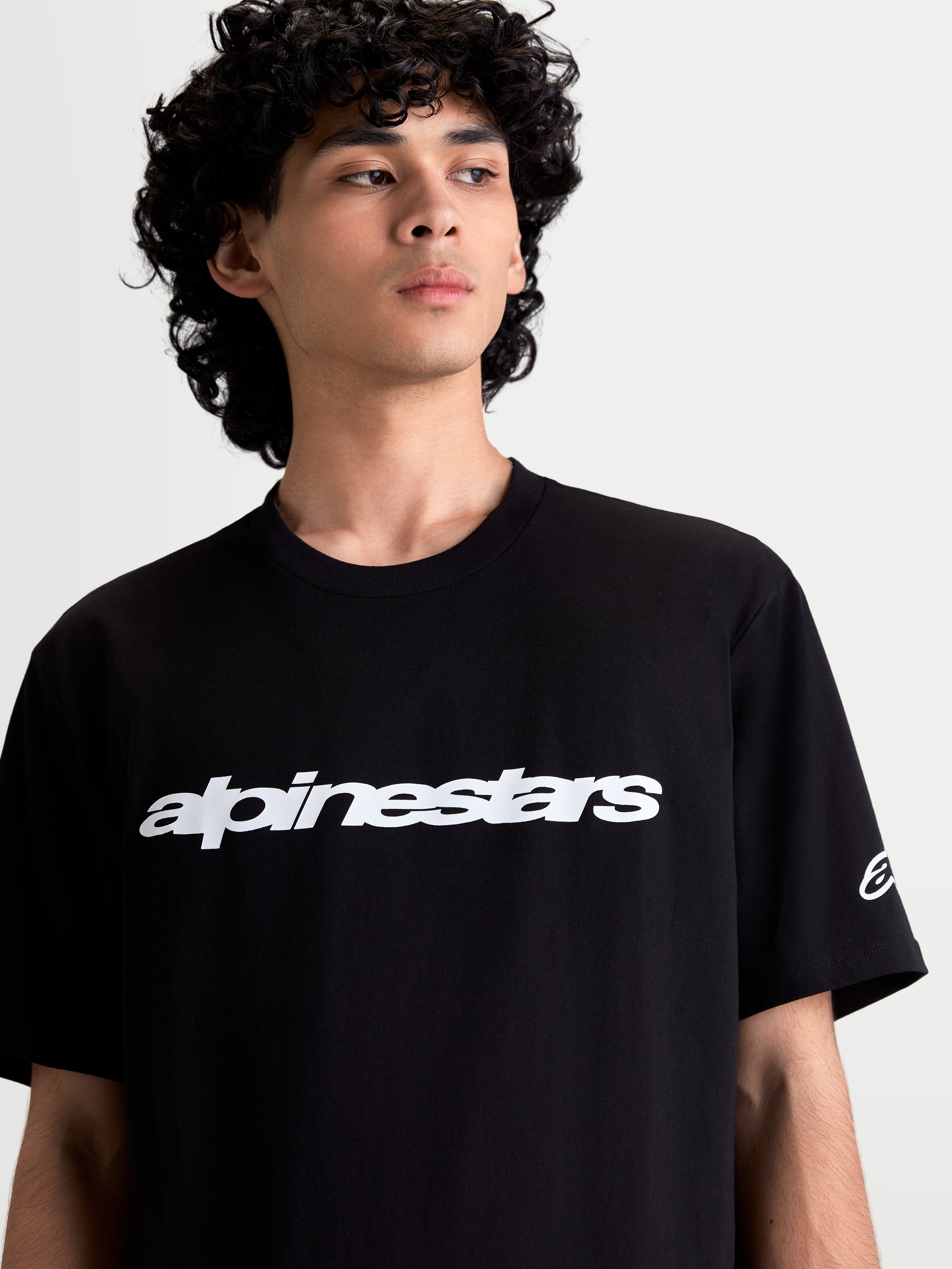 Alpinestars Race Wordmark CSF Tee, Men's Short Sleeve Sportswear T-Shirt, Black and White, featuring a bold front wordmark graphic and sleeve ageless logo, soft combed ring-spun cotton-poly blend for everyday comfort.