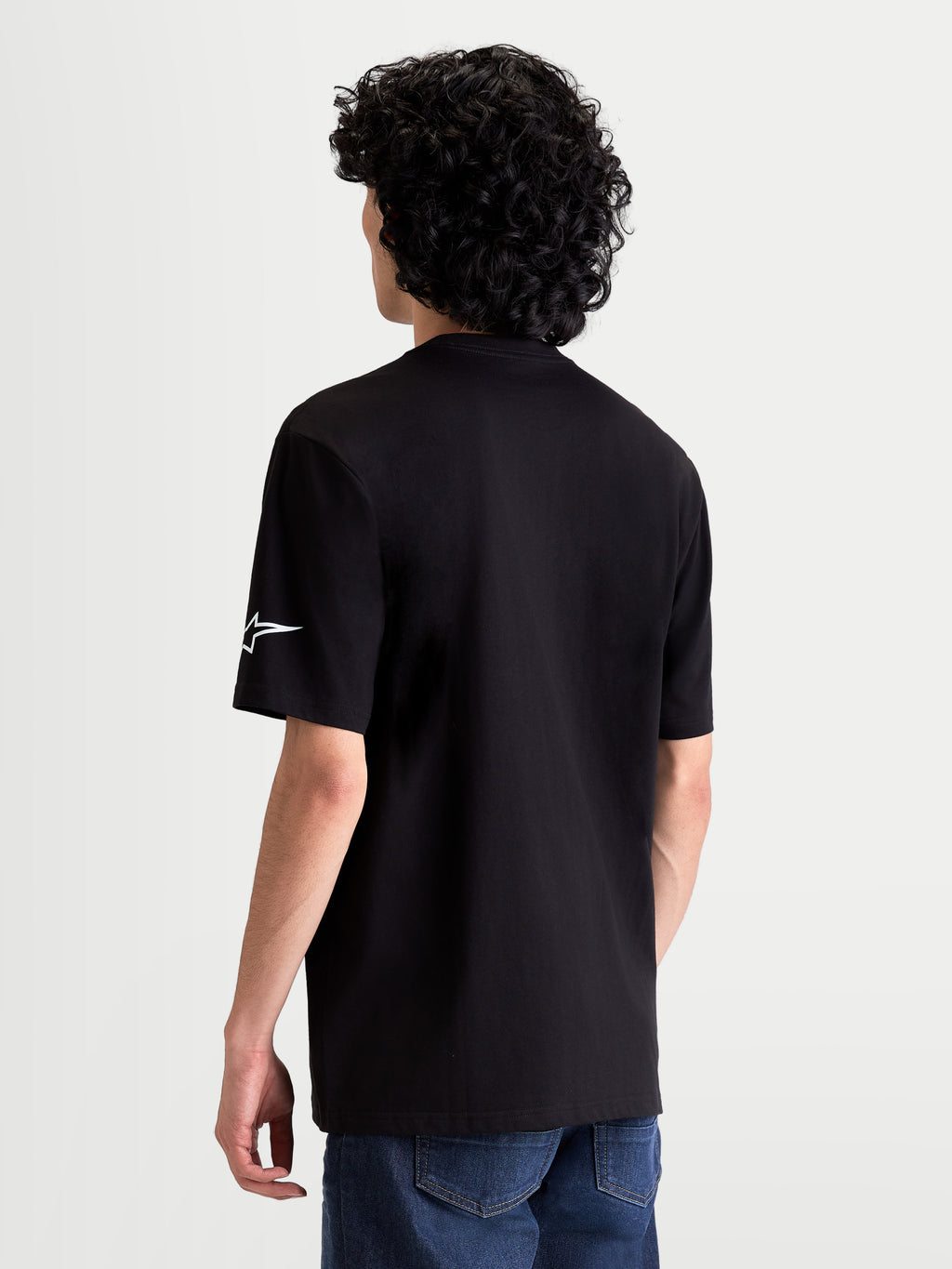 Alpinestars Race Wordmark CSF Tee, Casual Sportswear Short Sleeve T-Shirt, Rear View On Model, Black with White Ageless Logo on Sleeve, Premium Cotton-Poly Blend Material