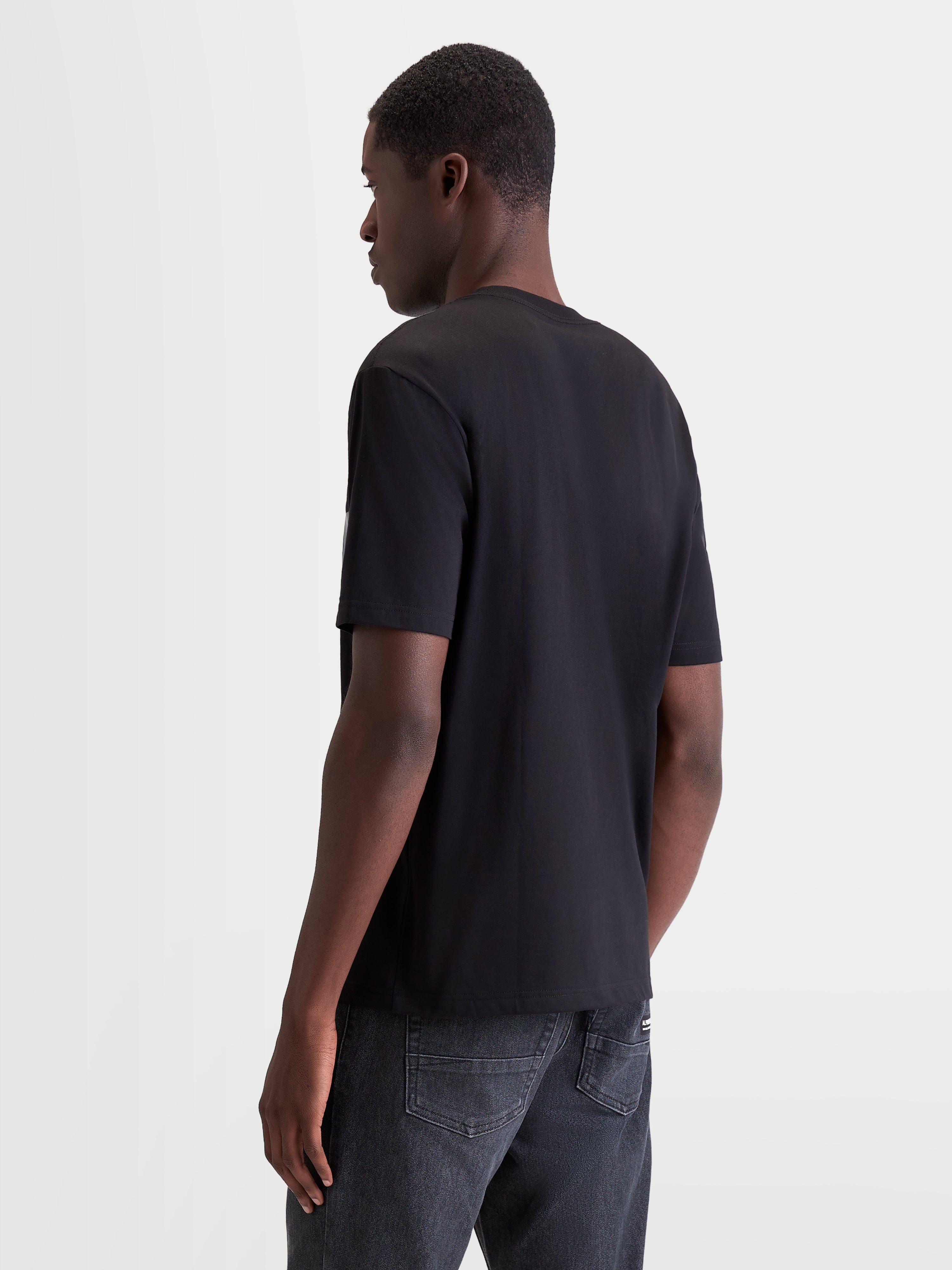 Alpinestars Singular CSF Tee, Men's Short Sleeve Sportswear T-Shirt in Black, back view on model, crafted from a soft cotton blend for everyday motorsport lifestyle comfort.