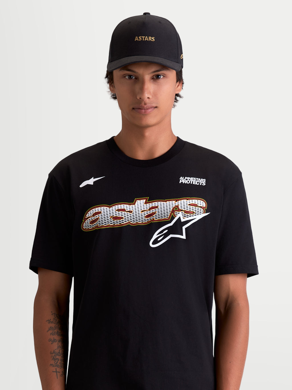 Alpinestars Cypress CSF Tee, Men's Short Sleeve Sportswear T-Shirt, Black and White, featuring a front mesh-fill graphic and Alpinestars Protects logo, on-model lifestyle view, premium cotton-poly material.