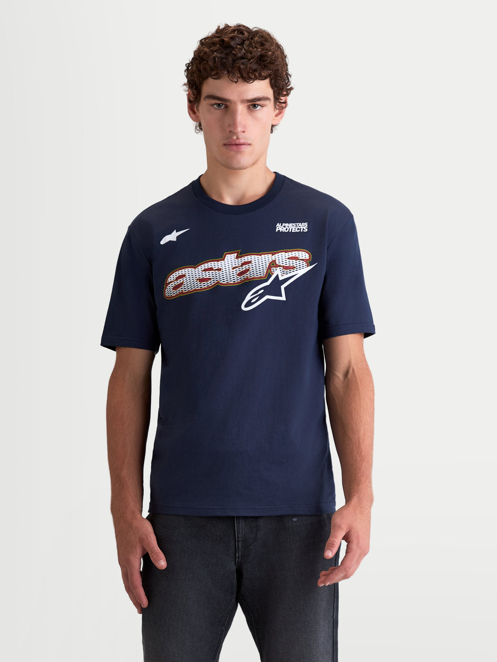 Alpinestars Cypress CSF Tee, Short Sleeve Sportswear T-Shirt, Navy Blue, featuring a front Astars word mesh-fill graphic with white and red accents, Unisex casual everyday apparel, on-model view, premium cotton-poly blend.