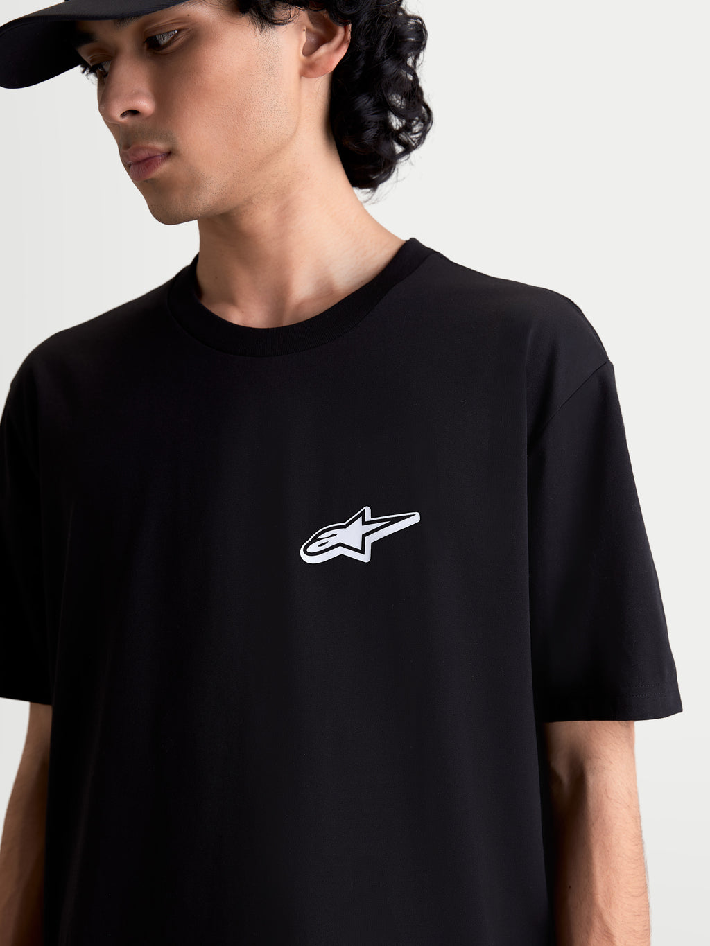 Alpinestars Meteor CSF Tee, Short Sleeve Sportswear T-Shirt, Unisex, Black, soft cotton-poly blend construction featuring a white Astars logo graphic on the chest, casual motorsport-inspired apparel.