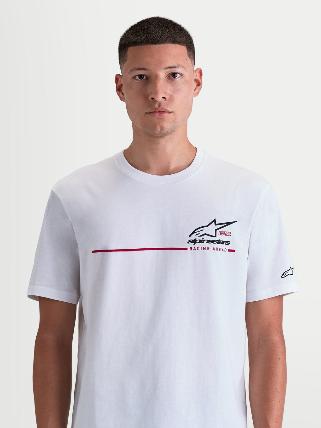 Alpinestars P1 CSF Tee, Short Sleeve Sportswear T-Shirt for Men and Women, White featuring a Black and Red Race Stripe Graphic and Racing Ahead text, soft Cotton-Poly blend construction for casual comfort.