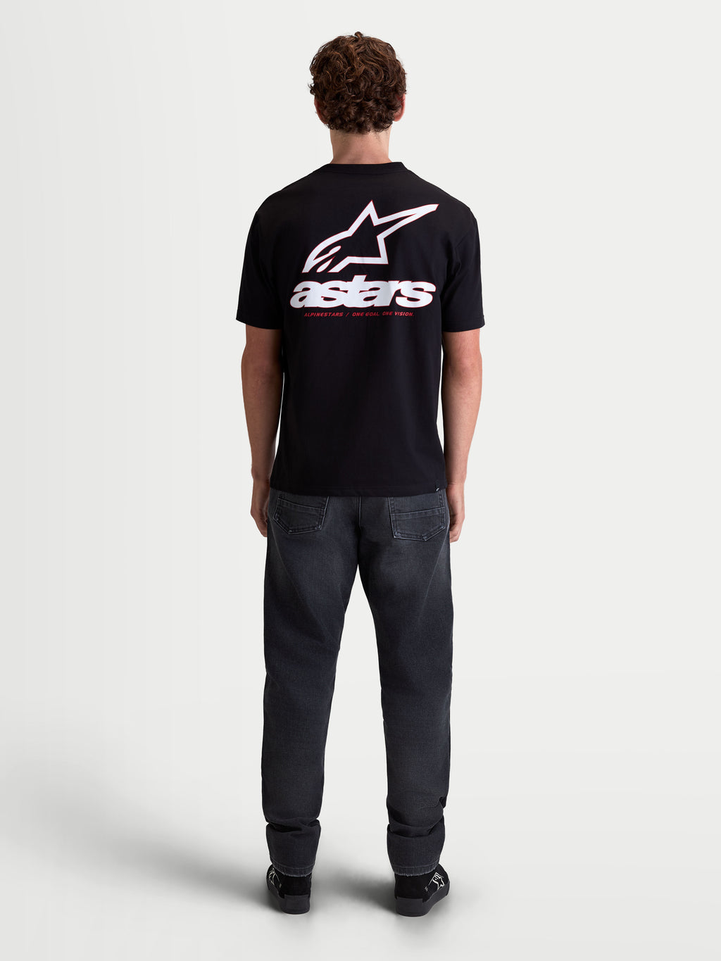 Alpinestars Lineout CSF Tee, Men's Short Sleeve Sportswear T-Shirt, Black with a large White Astars logo and 'astars' text graphic on the back, shown on model from behind, cotton-polyester blend.