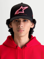Alpinestars Lineout Hat, Sportswear Curved Bill Baseball Cap, Black with Red and White embroidered Astars logo and One Goal One Vision branding, front view on model wearing a red hoodie, structured twill construction.